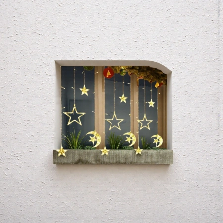 Star and moon-shaped decorative string lights create a dreamy warm indoor atmosphere light Star and moon-shaped decorative string lights create a dreamy warm indoor atmosphere light